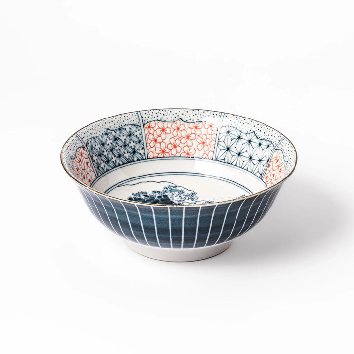 Japanese porcelain ramen bowl featuring Hokusai Great Wave design with red and blue geometric patterns in traditional style.