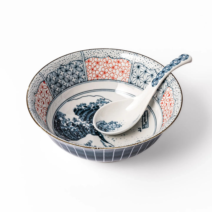 Japanese porcelain ramen bowl and spoon featuring Hokusai Great Wave design with red and blue geometric border patterns.
