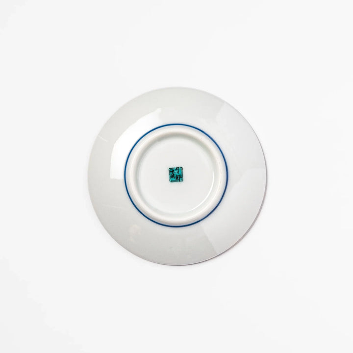 Blue Japanese ceramic sauce dish adorned with white sakura blossom and petals, ideal for traditional dining and serving soy sauce or condiments.