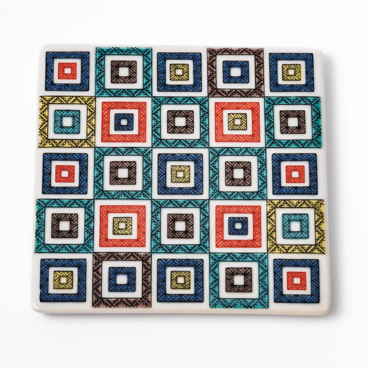Square Japanese ceramic coaster with colorful cobblestone mosaic pattern in red, blue, green, yellow, and black, ideal for stylish table settings.
