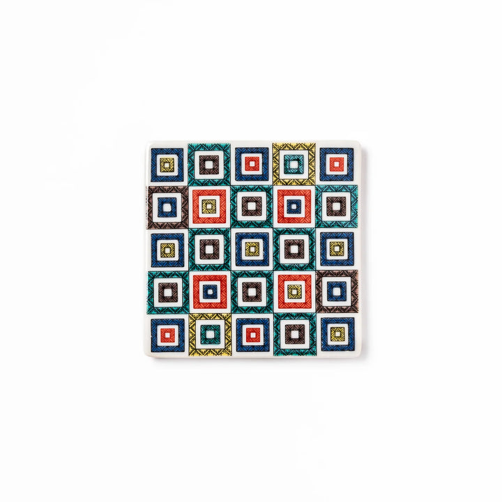 Square Japanese ceramic coaster with colorful cobblestone mosaic pattern in red, blue, green, yellow, and black, ideal for stylish table settings.