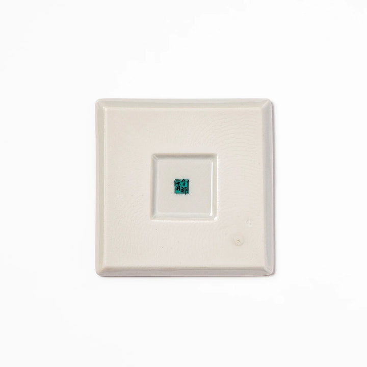 Square Japanese ceramic coaster with colorful cobblestone mosaic pattern in red, blue, green, yellow, and black, ideal for stylish table settings.