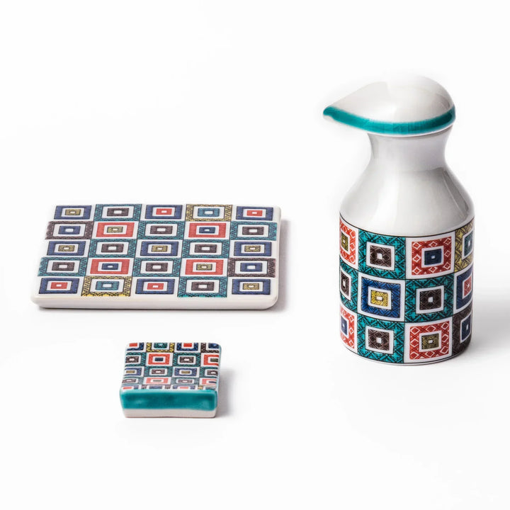 Japanese ceramic set including soy sauce dispenser, coaster, and chopstick rest with colorful cobblestone mosaic pattern, perfect for elegant dining