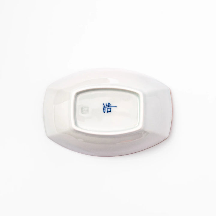 White boat-shaped bowl with blue floral patterns on the inner rim and a rustic brown edge, perfect for cereal or side dishes.