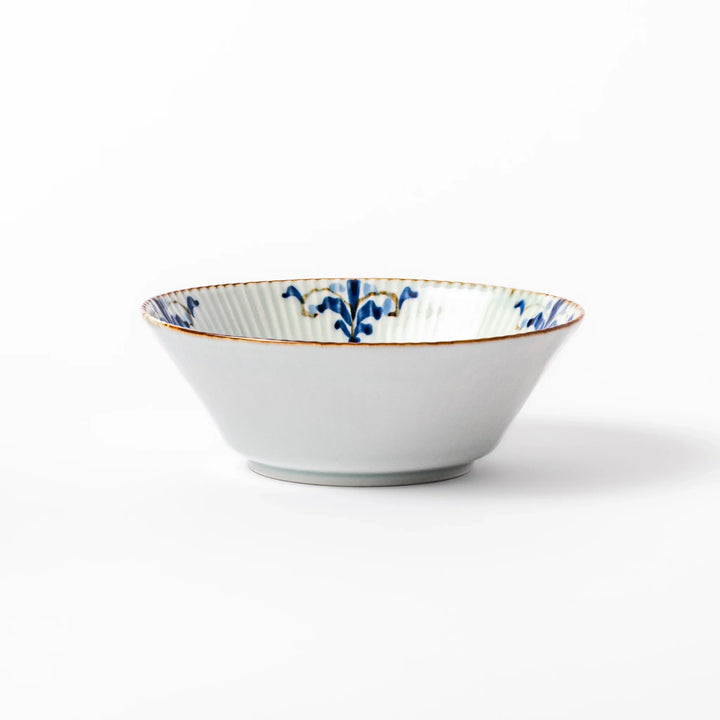 Ridged white bowl with blue floral designs around the inner rim and a brown edge, perfect for cereal, soup, or salad.