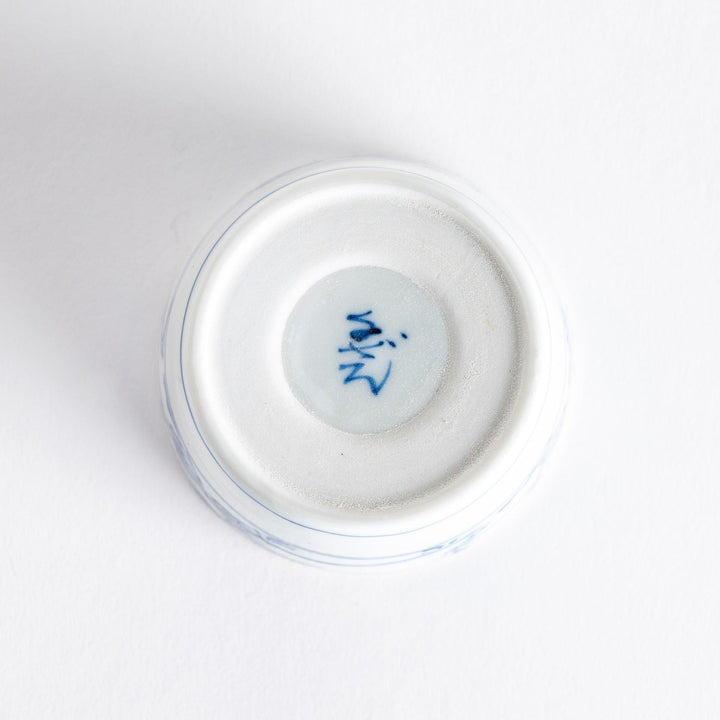A small bowl with delicate blue floral designs flowing along the surface, perfect for condiments or small servings.