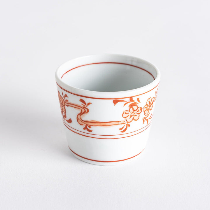 A small bowl with delicate blue floral designs flowing along the surface, perfect for condiments or small servings.
