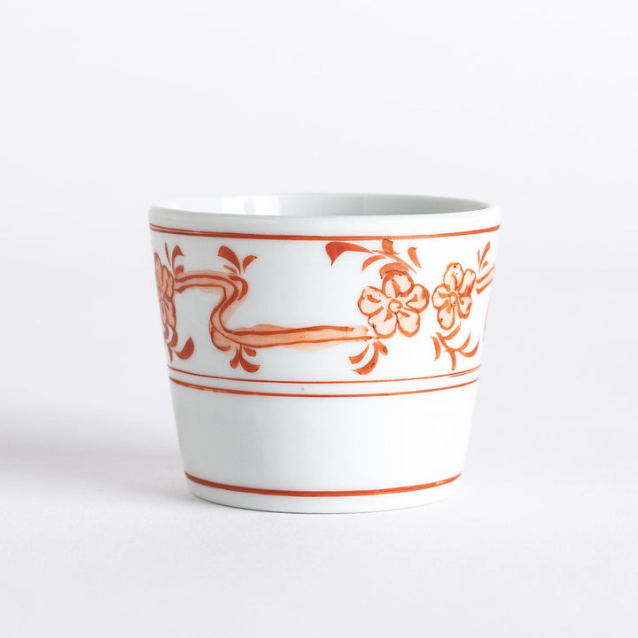 A small bowl with delicate blue floral designs flowing along the surface, perfect for condiments or small servings.