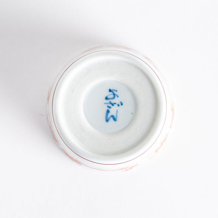 A small bowl with delicate blue floral designs flowing along the surface, perfect for condiments or small servings.