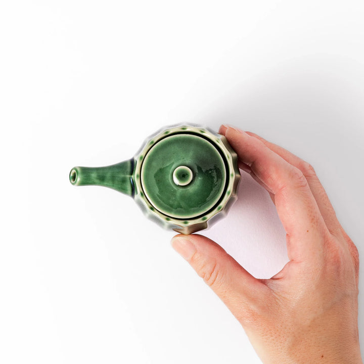 Elegant Mino ware soy sauce dispenser with a forest-inspired green glaze and drip-resistant spout. A perfect blend of tradition, function, and beauty.