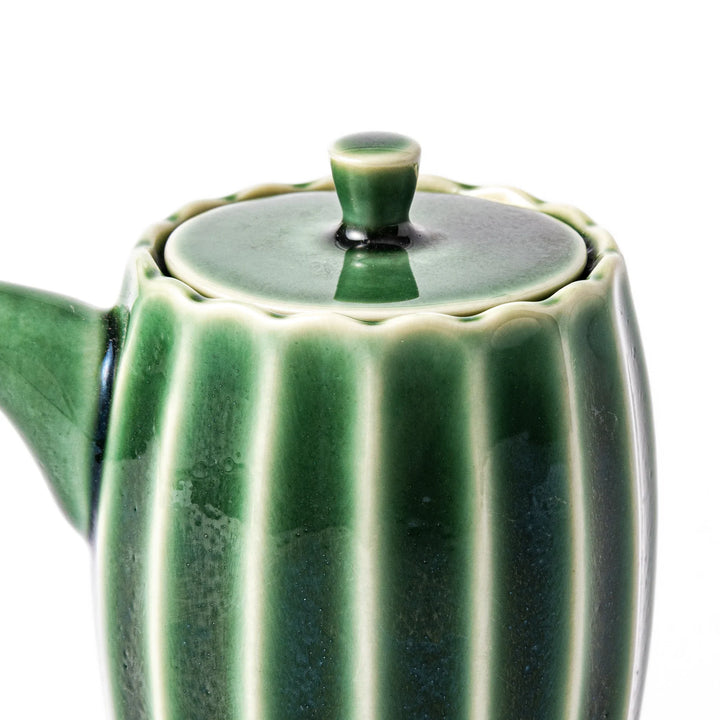 Elegant Mino ware soy sauce dispenser with a forest-inspired green glaze and drip-resistant spout. A perfect blend of tradition, function, and beauty.