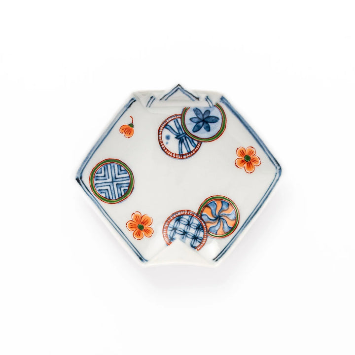 Japanese porcelain origami-shaped sauce dish with geometric circle and floral motifs, handcrafted in Japan for soy sauce, condiments, or appetizers