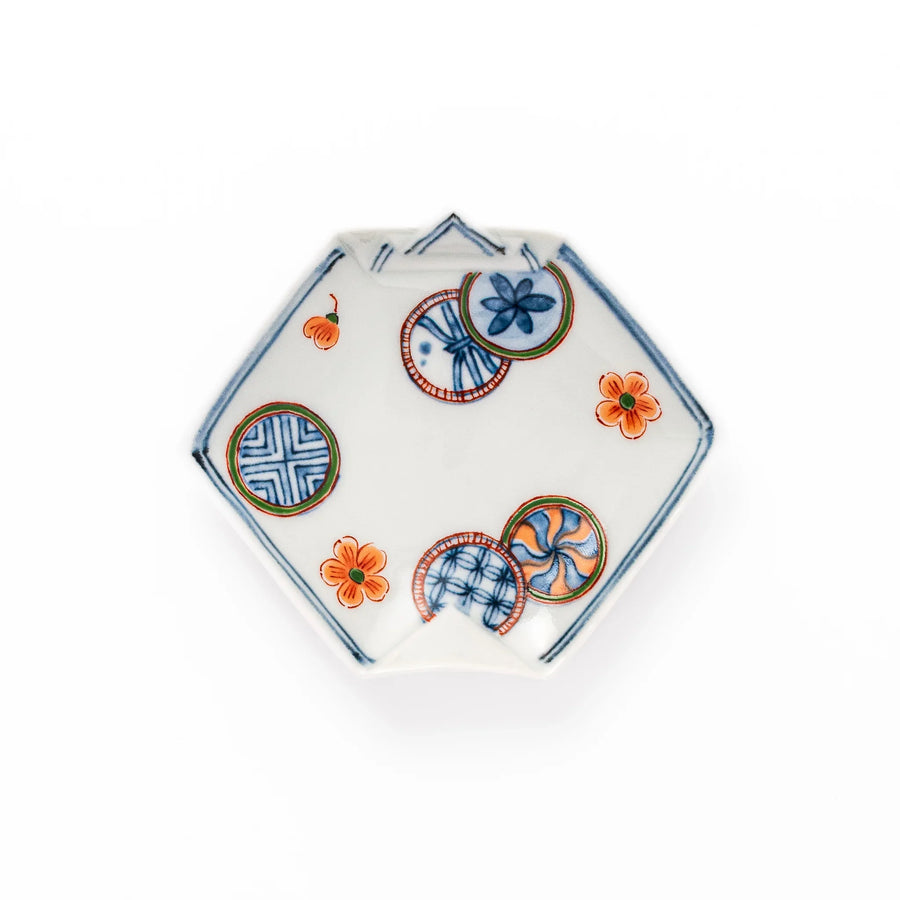 Japanese porcelain origami-shaped sauce dish with geometric circle and floral motifs, handcrafted in Japan for soy sauce, condiments, or appetizers