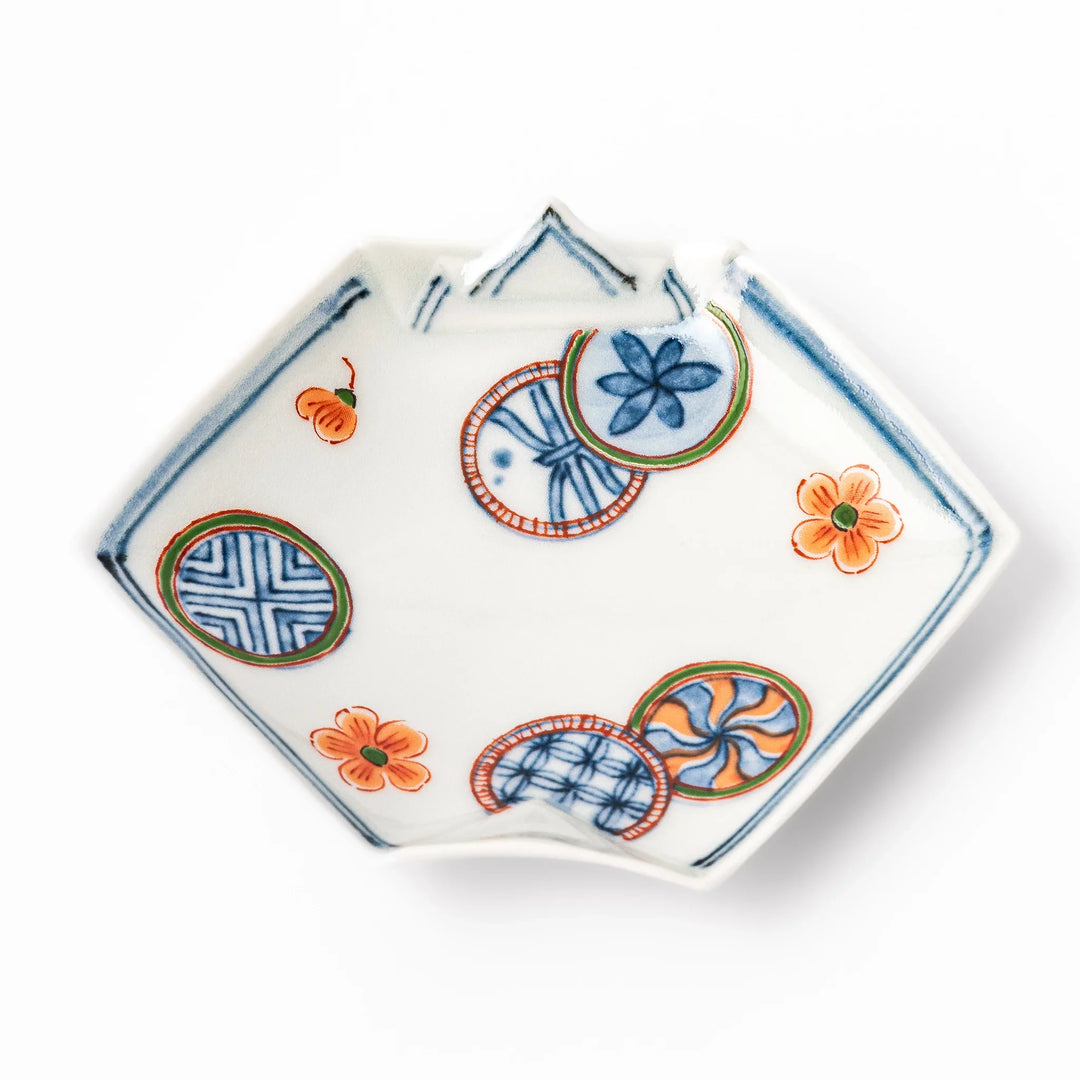 Japanese porcelain origami-shaped sauce dish with geometric circle and floral motifs, handcrafted in Japan for soy sauce, condiments, or appetizers