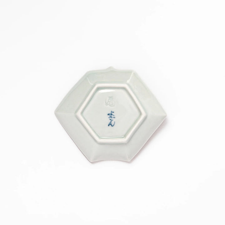 Japanese porcelain origami-shaped sauce dish with geometric circle and floral motifs, handcrafted in Japan for soy sauce, condiments, or appetizers