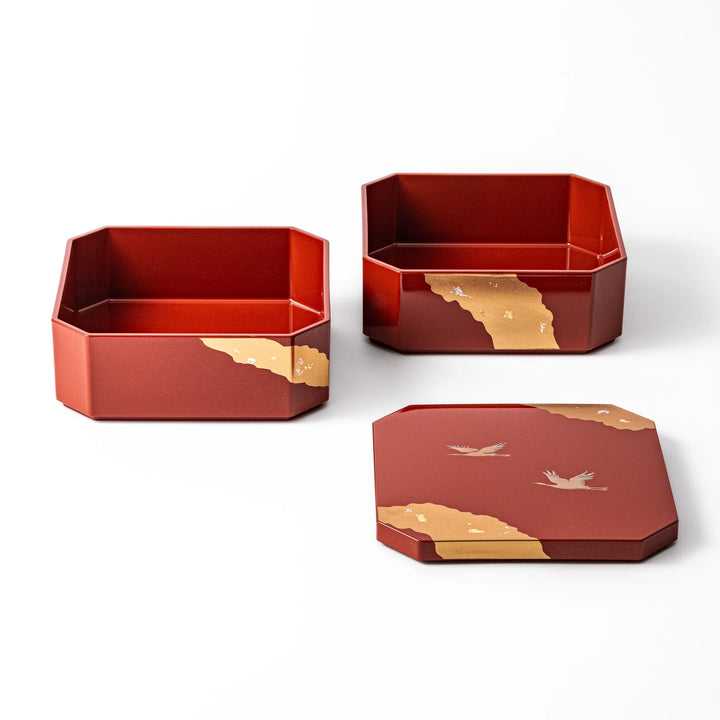 Gold River & Crane Japanese Jubako Box in hexagonal form with gold river and crane motif on vermilion red lacquer, perfect for festive food presentation.