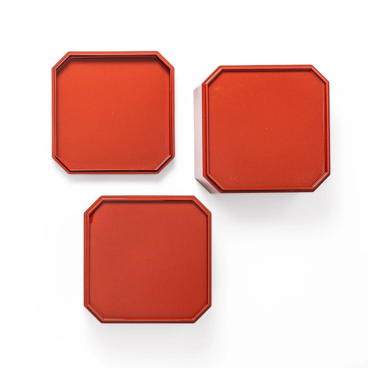 Gold River & Crane Japanese Jubako Box in hexagonal form with gold river and crane motif on vermilion red lacquer, perfect for festive food presentation.