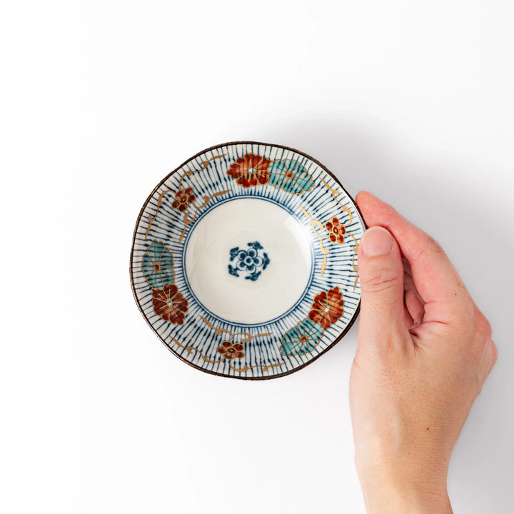Scalloped Japanese dessert bowl with blue stripes, red and teal floral motifs, and gold accents—perfect for traditional sweets or small side dishes.