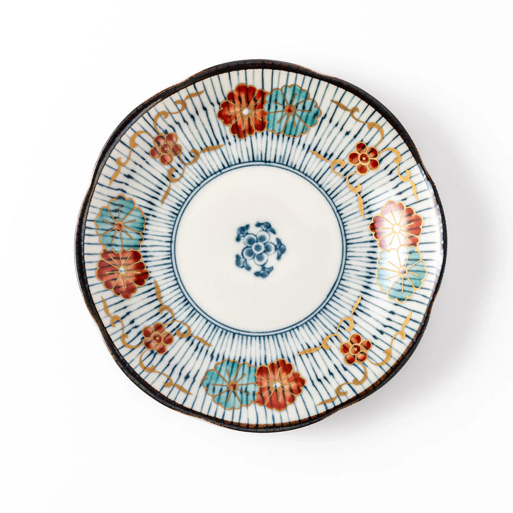 Scalloped Japanese dessert plate with vertical blue stripes and red, teal, and gold floral accents, perfect for serving sweets or small treats in style.