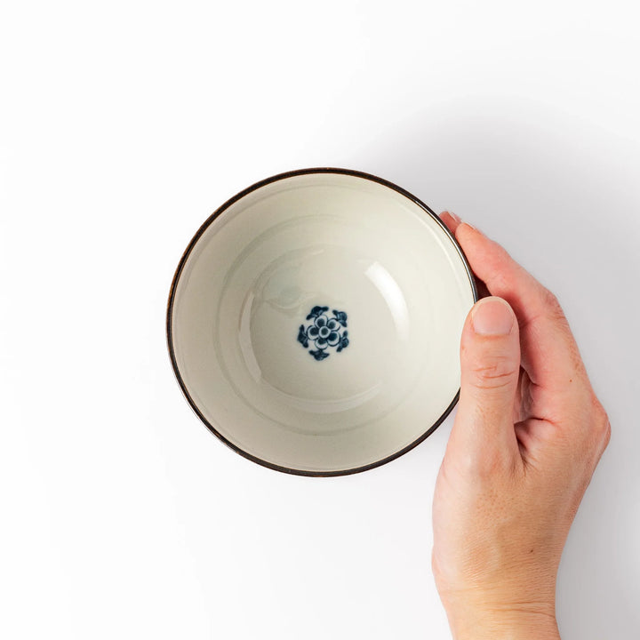 Traditional Japanese rice bowl with vertical blue stripes and red, teal, and gold floral designs, perfect for brightening up everyday meals.