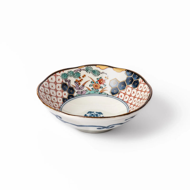 Scalloped Japanese dessert bowl with vibrant floral designs, red lattice, and navy hexagon accents, perfect for traditional sweets or small side dishes.