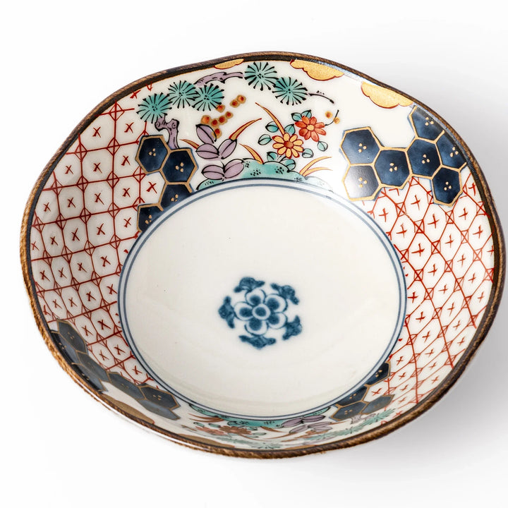 Scalloped Japanese dessert bowl with vibrant floral designs, red lattice, and navy hexagon accents, perfect for traditional sweets or small side dishes.