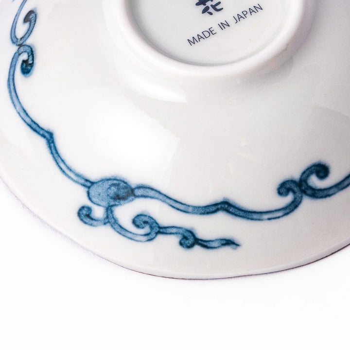 Scalloped Japanese dessert bowl with vibrant floral designs, red lattice, and navy hexagon accents, perfect for traditional sweets or small side dishes.