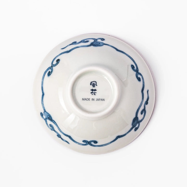 Scalloped Japanese dessert bowl with vibrant floral designs, red lattice, and navy hexagon accents, perfect for traditional sweets or small side dishes.