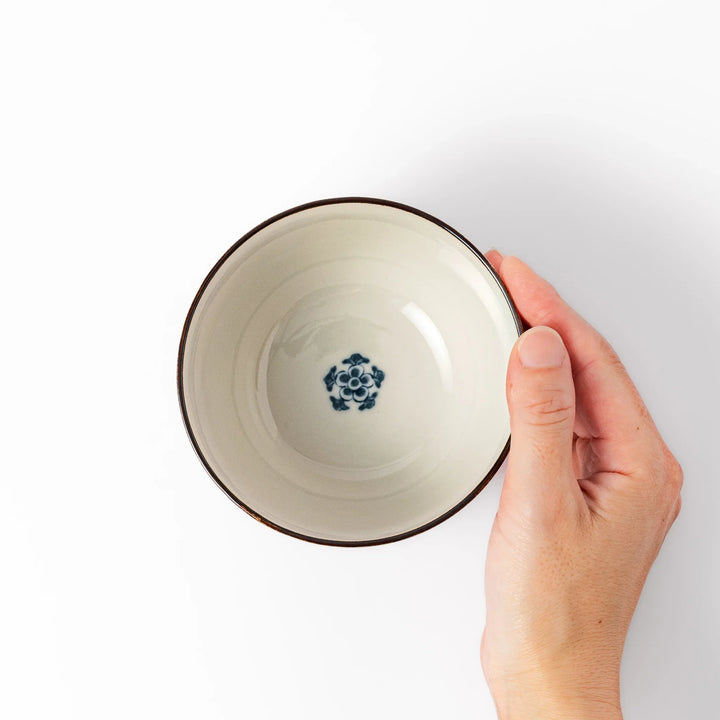 Traditional Japanese rice bowl featuring red lattice, navy hexagons, and multicolor floral motifs, perfect for adding elegance to everyday meals.