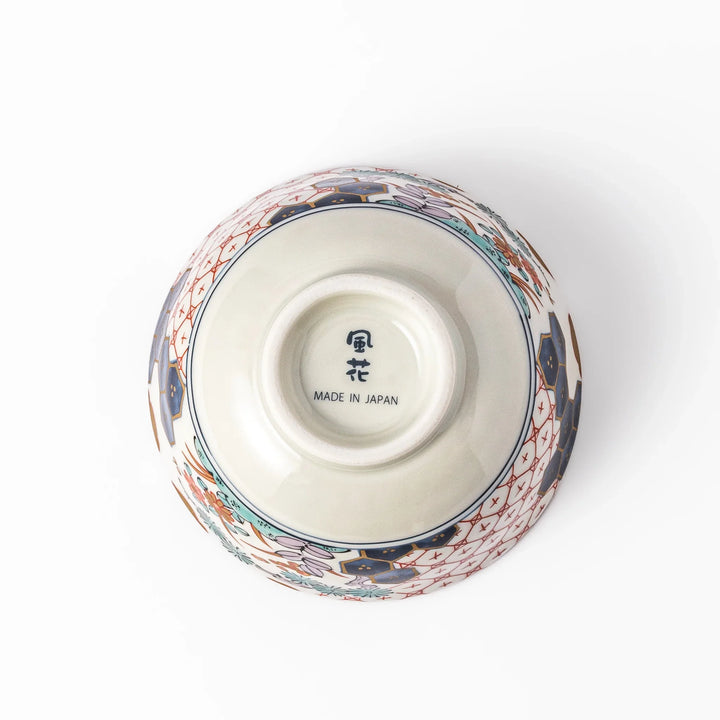 Traditional Japanese rice bowl featuring red lattice, navy hexagons, and multicolor floral motifs, perfect for adding elegance to everyday meals.