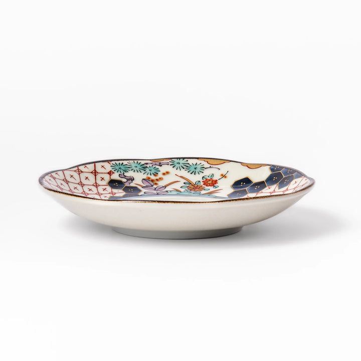 Scalloped Japanese sauce dish with red lattice, floral motifs, and navy hexagon accents, perfect for adding charm to traditional table settings.