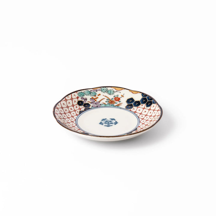 Scalloped Japanese sauce dish with red lattice, floral motifs, and navy hexagon accents, perfect for adding charm to traditional table settings.