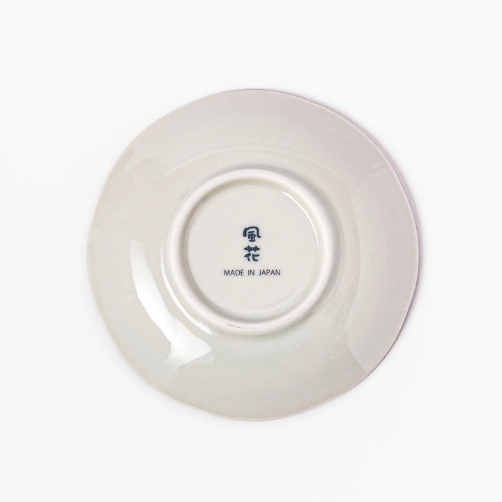 Scalloped Japanese sauce dish with red lattice, floral motifs, and navy hexagon accents, perfect for adding charm to traditional table settings.