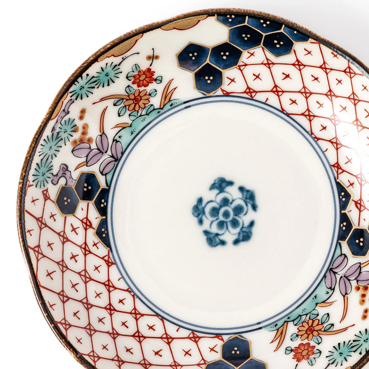 Scalloped Japanese sauce dish with red lattice, floral motifs, and navy hexagon accents, perfect for adding charm to traditional table settings.
