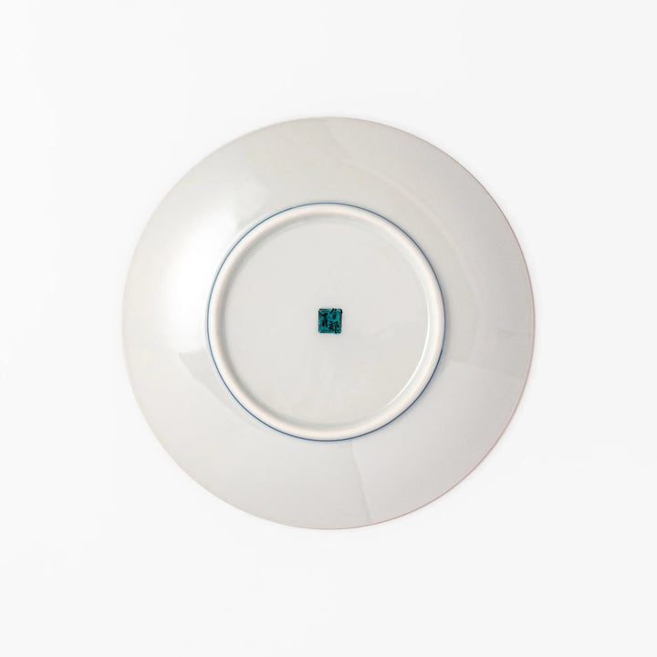 Round Kutani dessert plate with a bold golden leaf and grape motif on a turquoise background patterned with black starbursts.