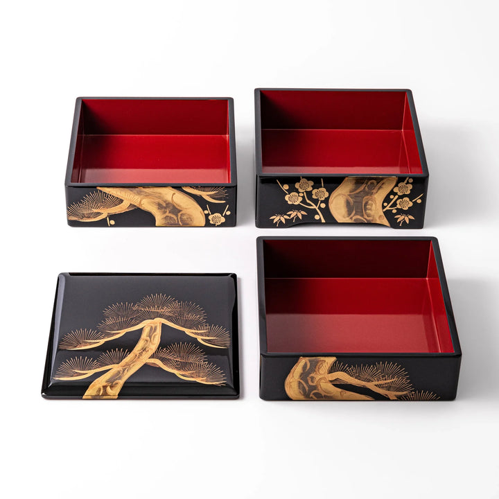 Interior view of the Golden Pine Japanese Jubako Box, revealing three red-lacquered tiers and lid with gold pine tree design, ideal for elegant food presentation.
