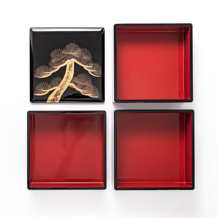 Interior view of the Golden Pine Japanese Jubako Box, revealing three red-lacquered tiers and lid with gold pine tree design, ideal for elegant food presentation.