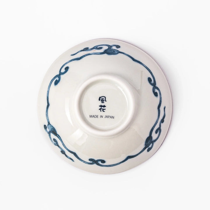 Scalloped Japanese dessert bowl with vibrant red, green, and gold patterns and a blue floral center, ideal for elegant traditional table settings.