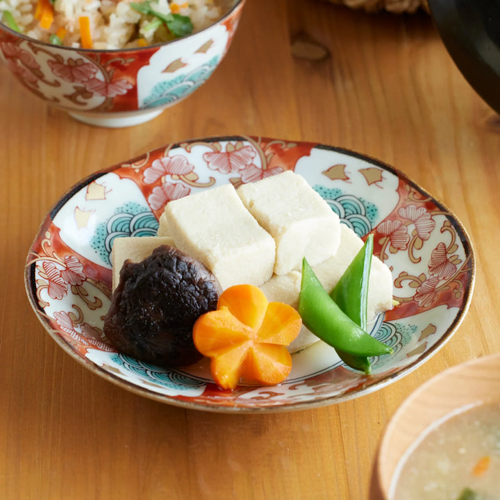 Golden Shorebird Dessert Plate with simmered tofu, shiitake mushroom, carrot flower, and snow peas served as a Japanese side dish.