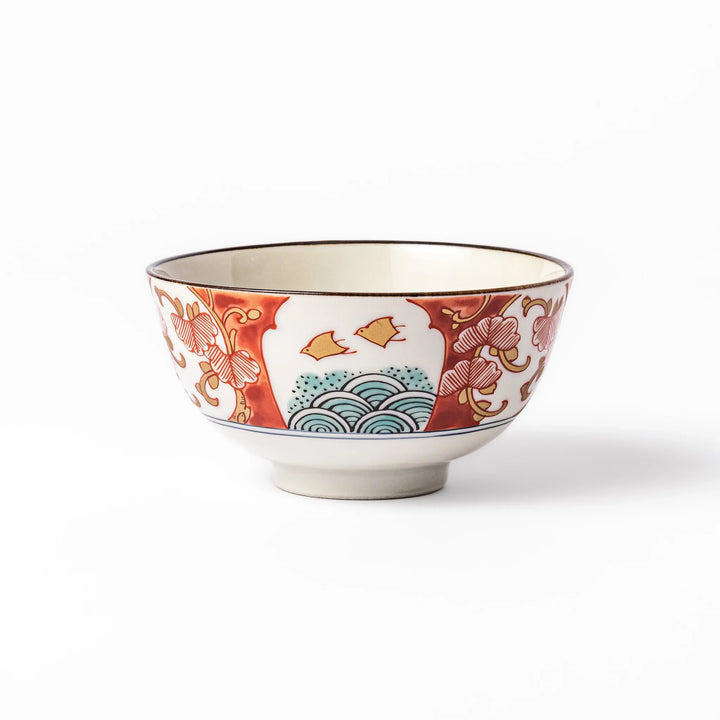 Traditional Japanese rice bowl featuring red, green, and gold motifs with waves, florals, and flying birds—perfect for refined, elegant dining.