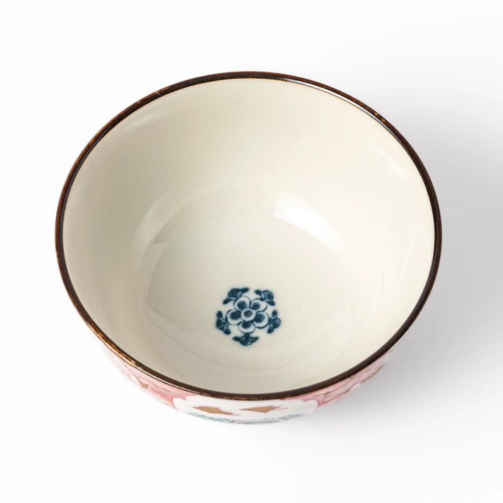Traditional Japanese rice bowl featuring red, green, and gold motifs with waves, florals, and flying birds—perfect for refined, elegant dining.
