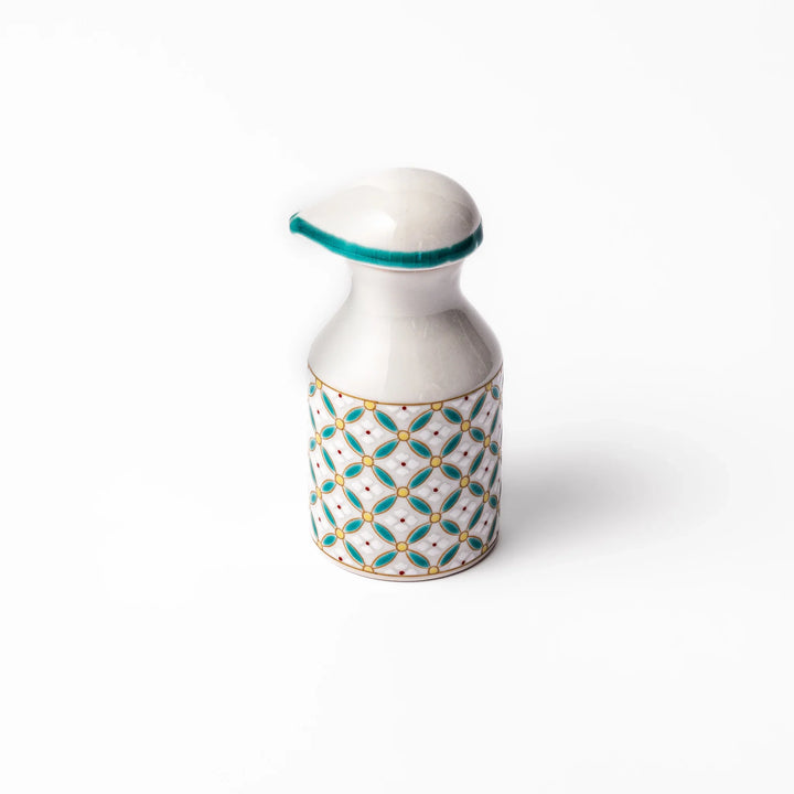 Japanese ceramic soy sauce dispenser with elegant geometric blossom pattern in teal, gold, and red accents, adding a refined traditional touch to dining tables.