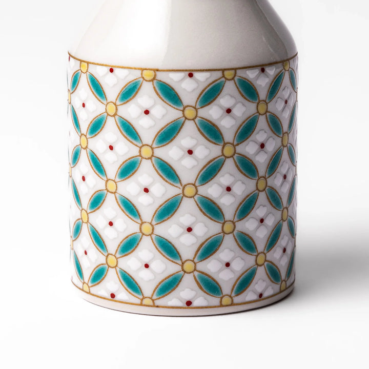 Japanese ceramic soy sauce dispenser with elegant geometric blossom pattern in teal, gold, and red accents, adding a refined traditional touch to dining tables.