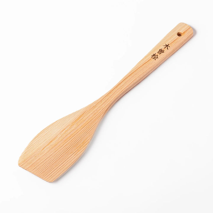 Compact hinoki wood spatula with a flat, angled edge and engraved handle, perfect for straining, flipping, and serving delicate dishes.