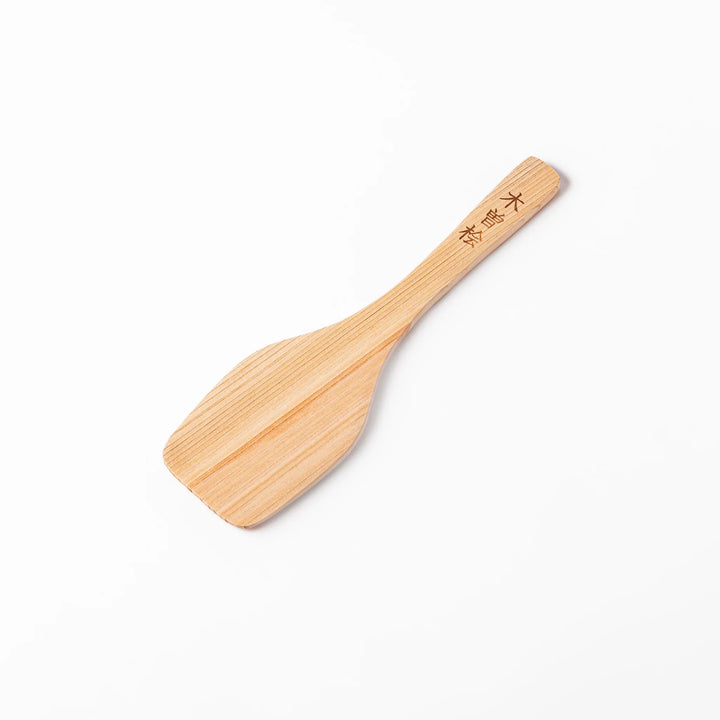 Compact hinoki wood spatula with a flat, angled edge and engraved handle, perfect for straining, flipping, and serving delicate dishes.