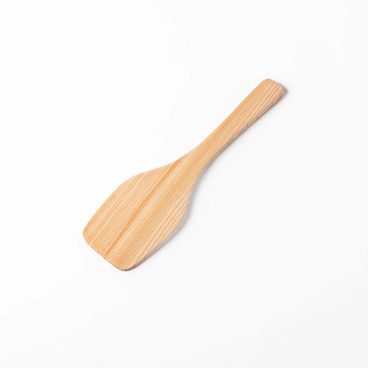 Compact hinoki wood spatula with a flat, angled edge and engraved handle, perfect for straining, flipping, and serving delicate dishes.