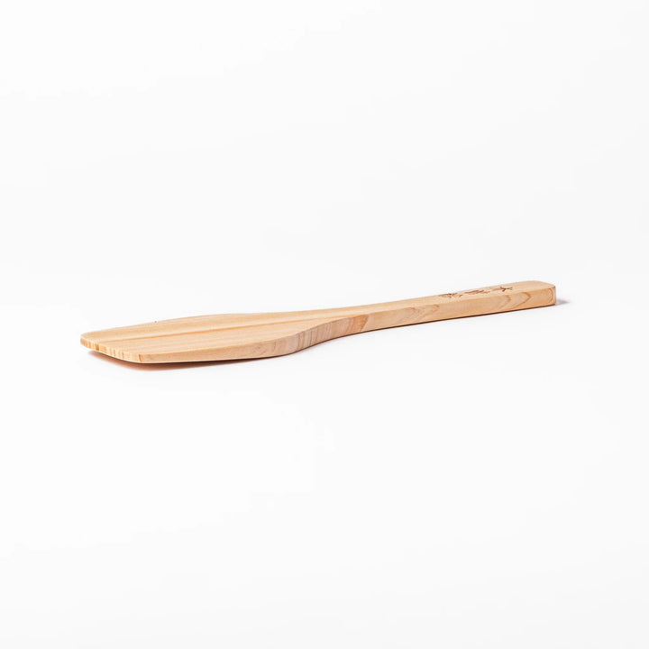 Compact hinoki wood spatula with a flat, angled edge and engraved handle, perfect for straining, flipping, and serving delicate dishes.