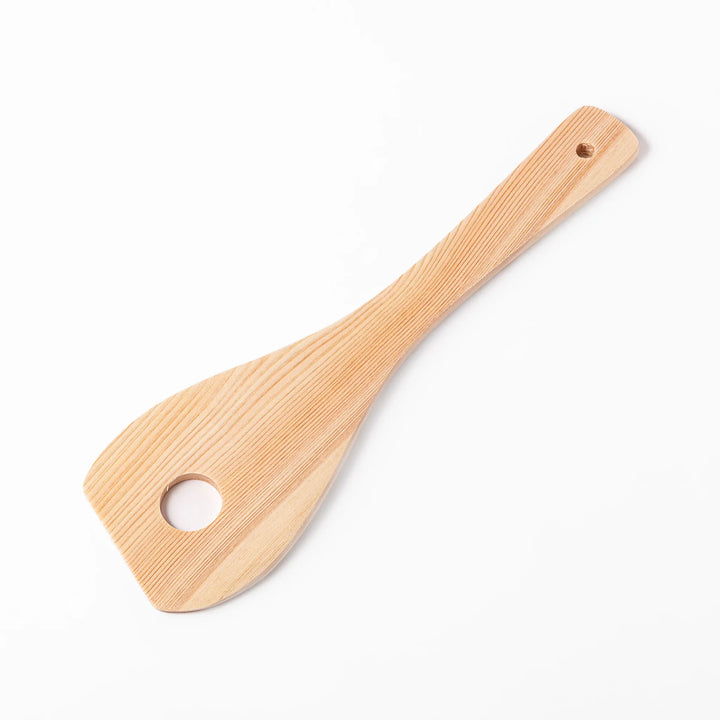 Hinoki wood slotted spatula with a circular cut-out and engraved handle, ideal for stirring and draining while adding a traditional Japanese touch.