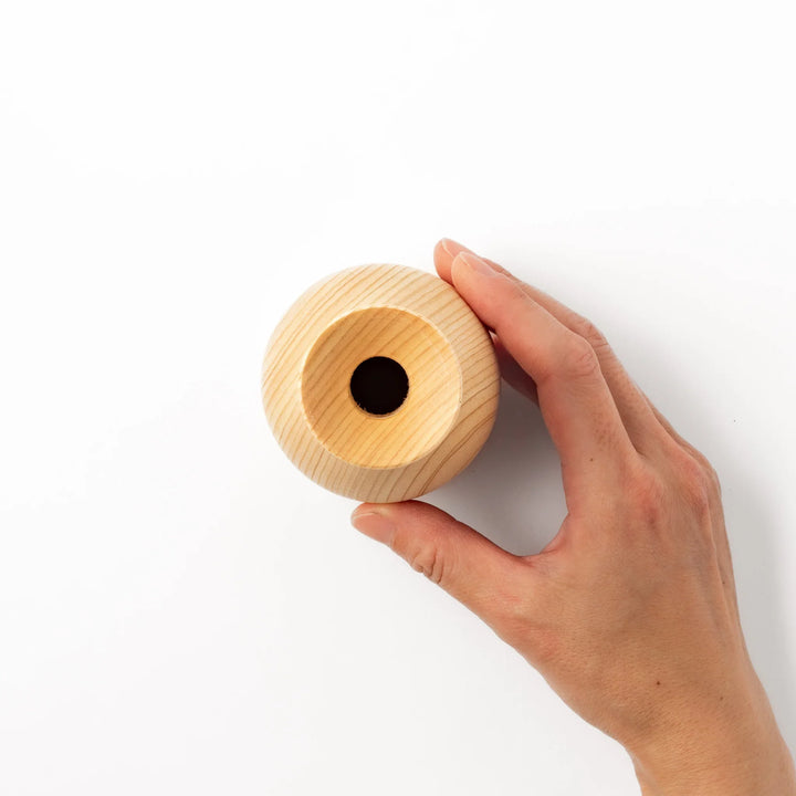 Hinoki wood sake set featuring one carafe and two cups, each adorned with an intricate burnt-in design, ideal for elevating traditional sake rituals.