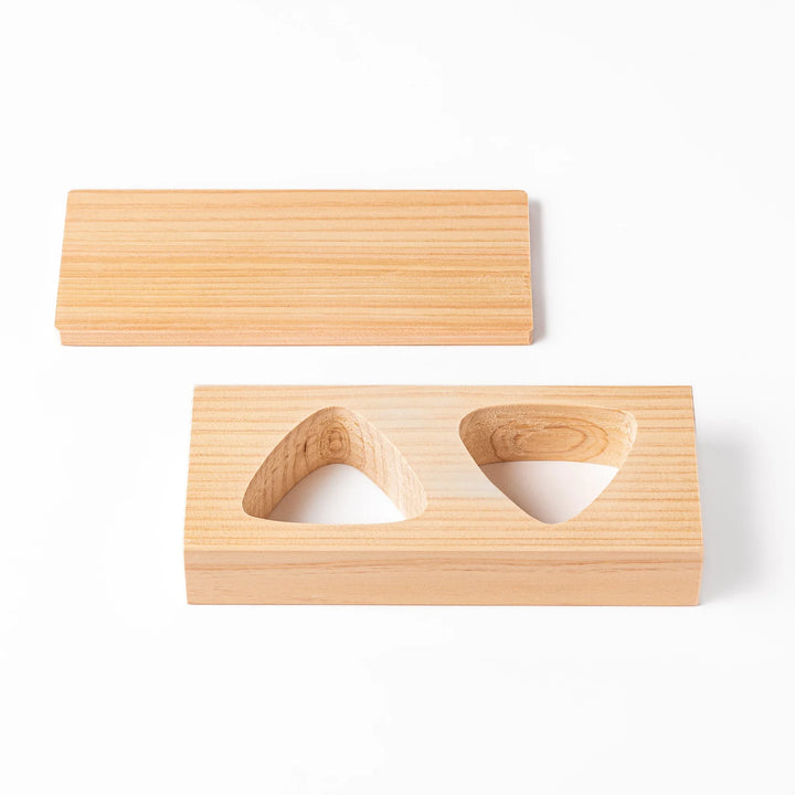 Hinoki wood onigiri mold with two triangle cavities and a matching lid, perfect for shaping traditional Japanese rice balls with ease and aroma.